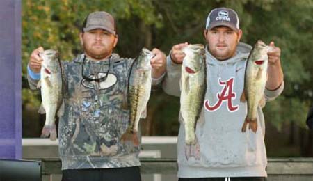 2014 Winners Jordan and Jesse Wiggins holding up four big bass for the win